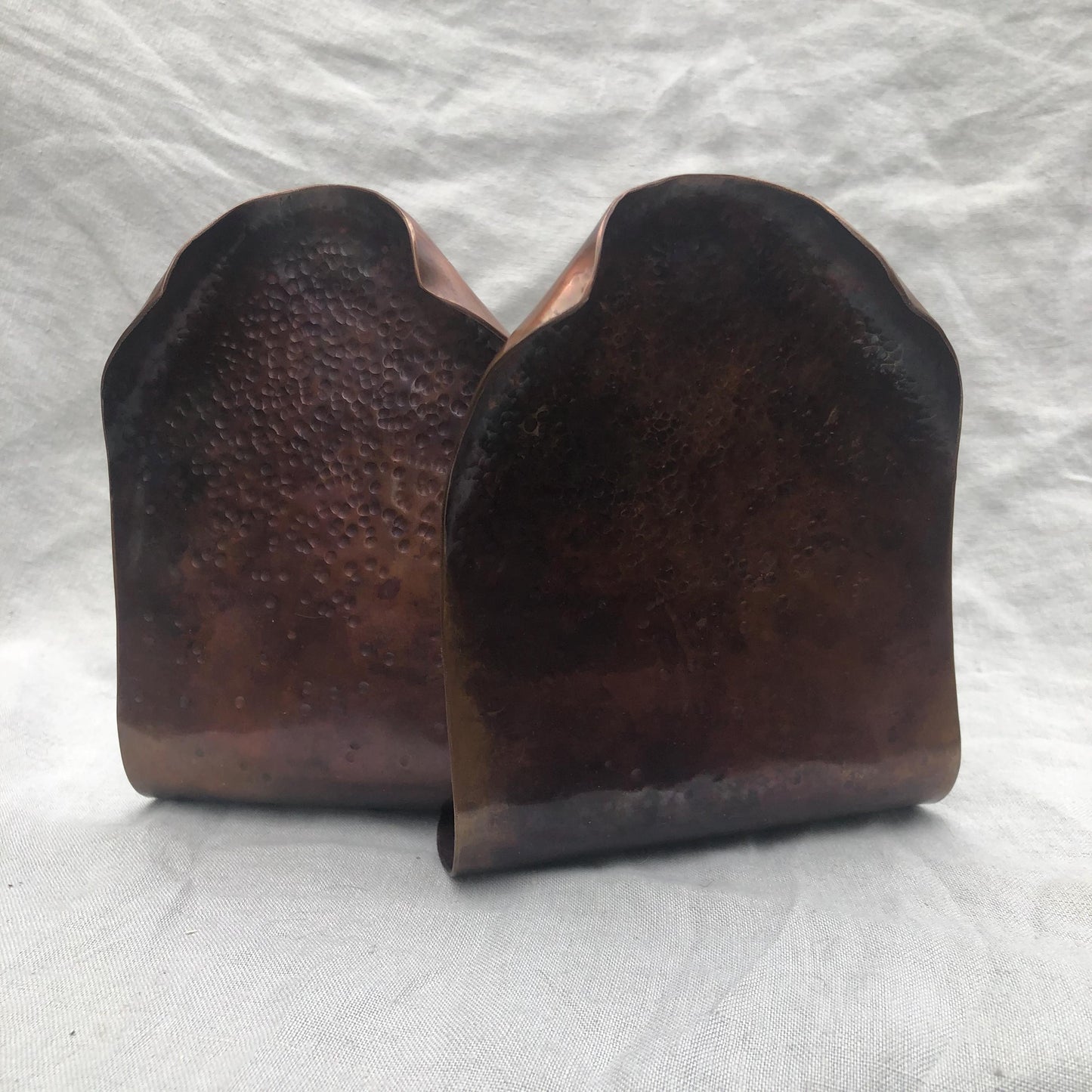 Hammered copper bookends with warm copper patina