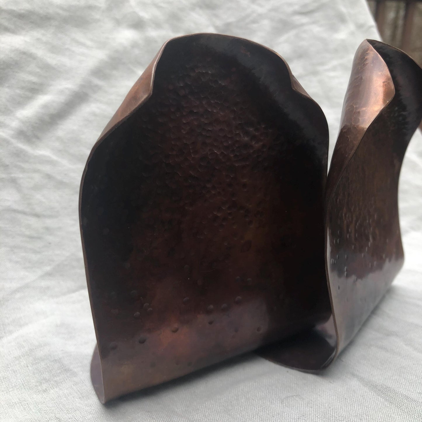 Hammered copper bookends with warm copper patina