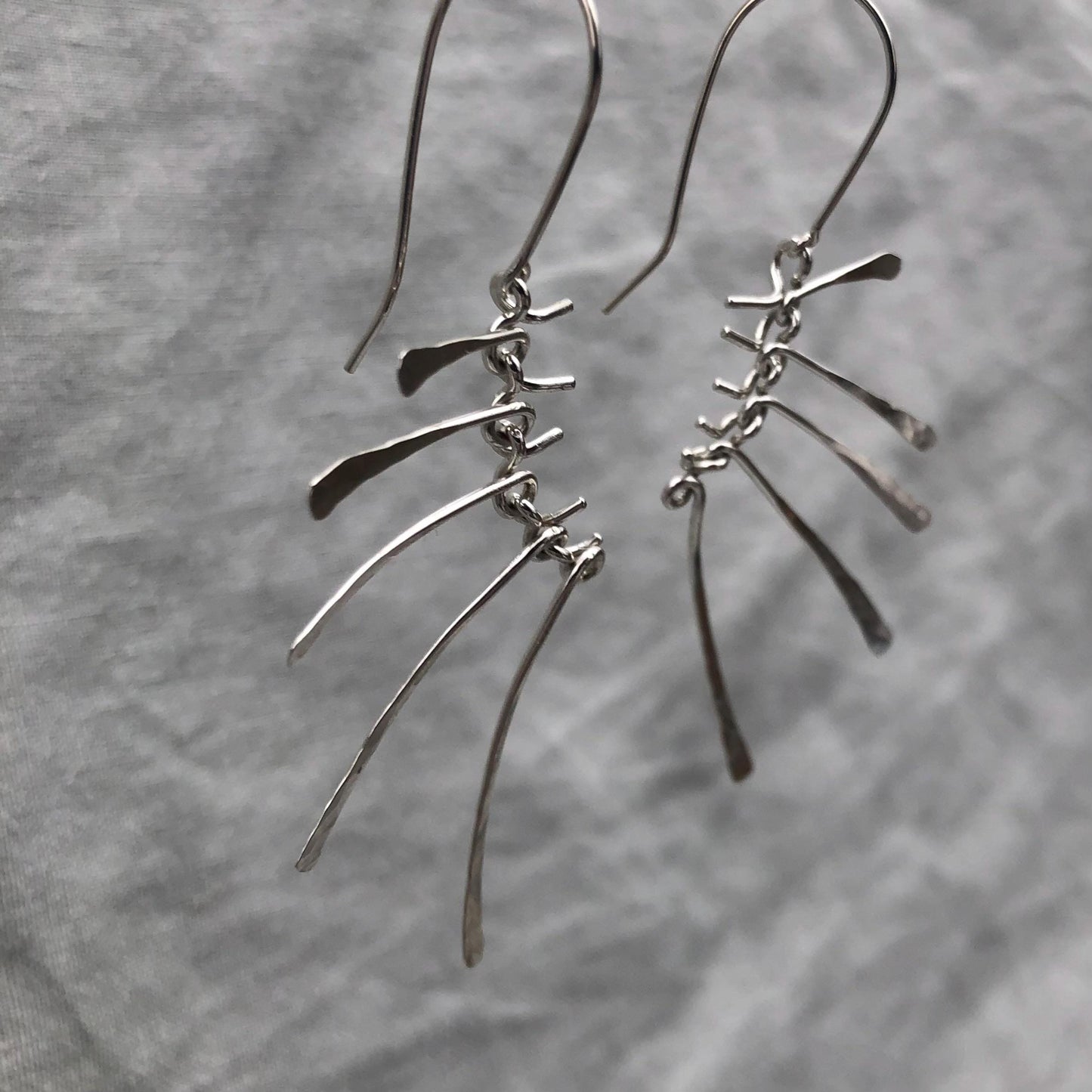 Kinetic sculptural earrings in argentium sterling silver // Bare Bones Earrings
