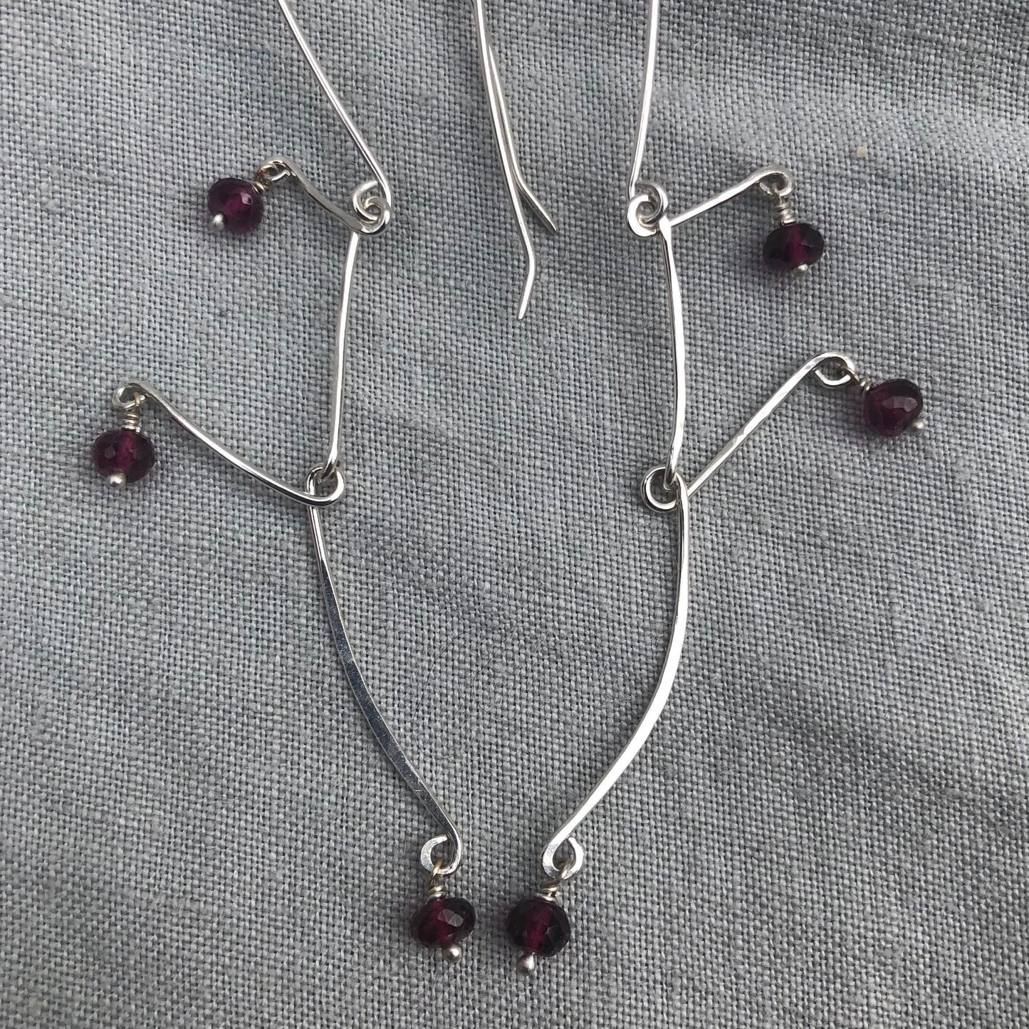Kinetic sculptural garnet earrings in argentium sterling silver // Rhodolite garnet Calder earrings