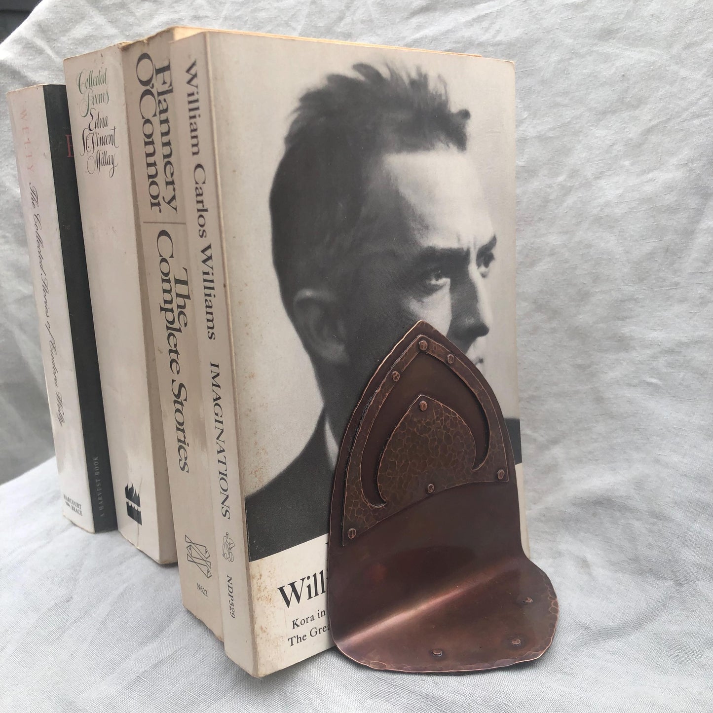 Riveted hammered copper bookends with warm copper patina