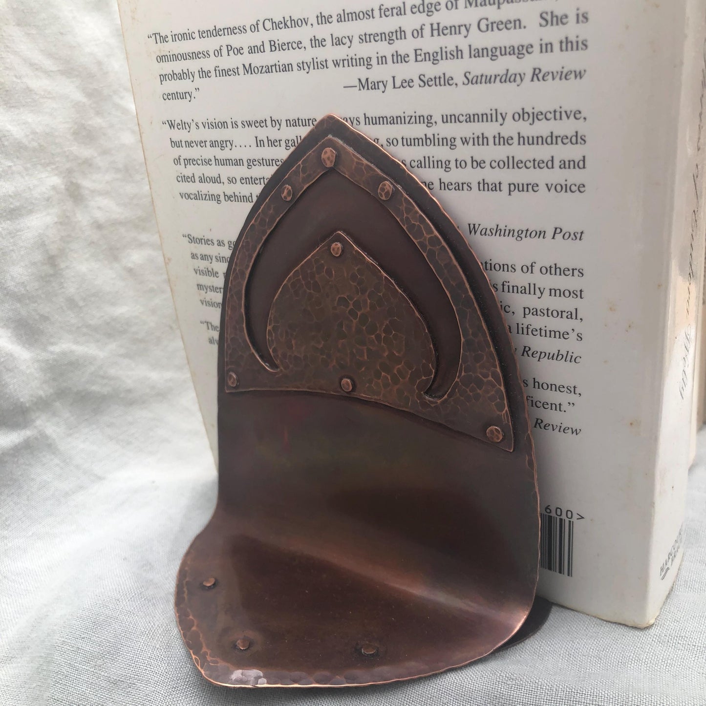 Riveted hammered copper bookends with warm copper patina