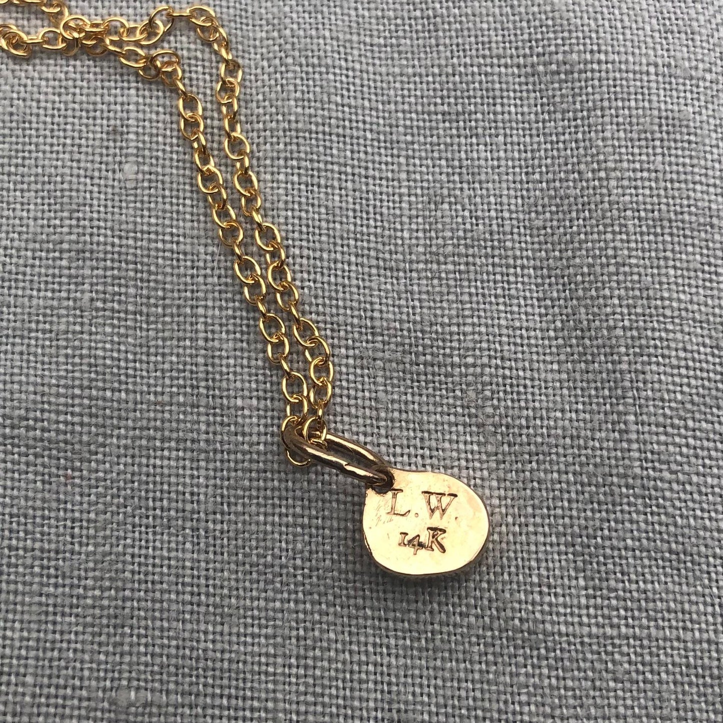 Solid gold padparadscha sapphire charm pendant // Asymmetrical unheated pink sapphire 14 karat gold necklace