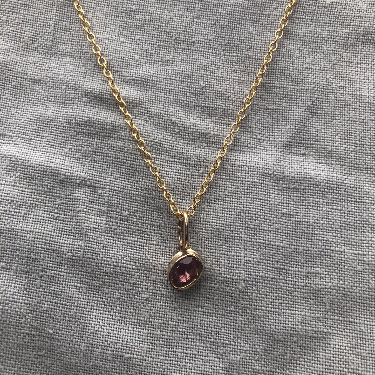 Solid gold padparadscha sapphire charm pendant // Asymmetrical unheated pink sapphire 14 karat gold necklace