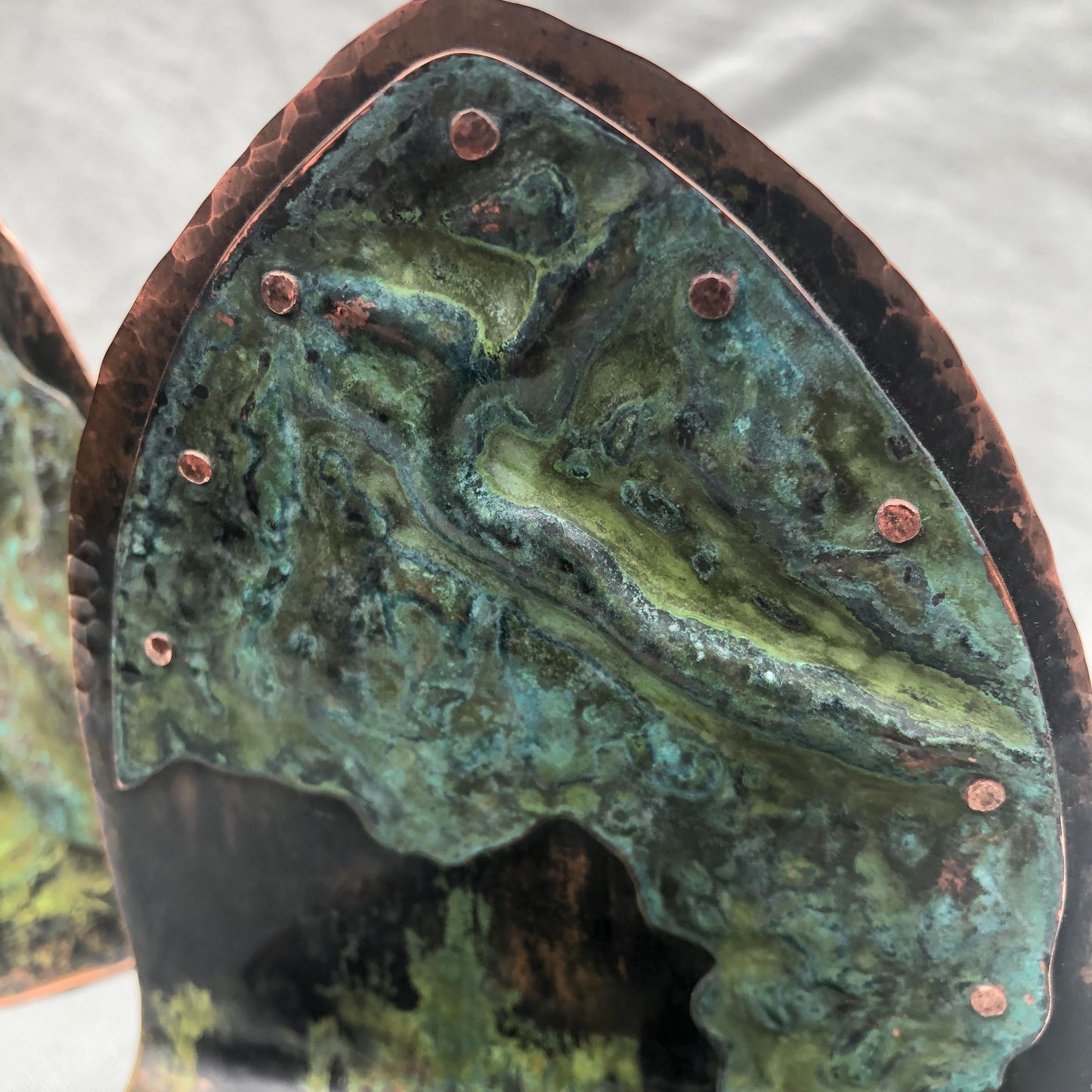 Riveted copper bookends with verdigris patina