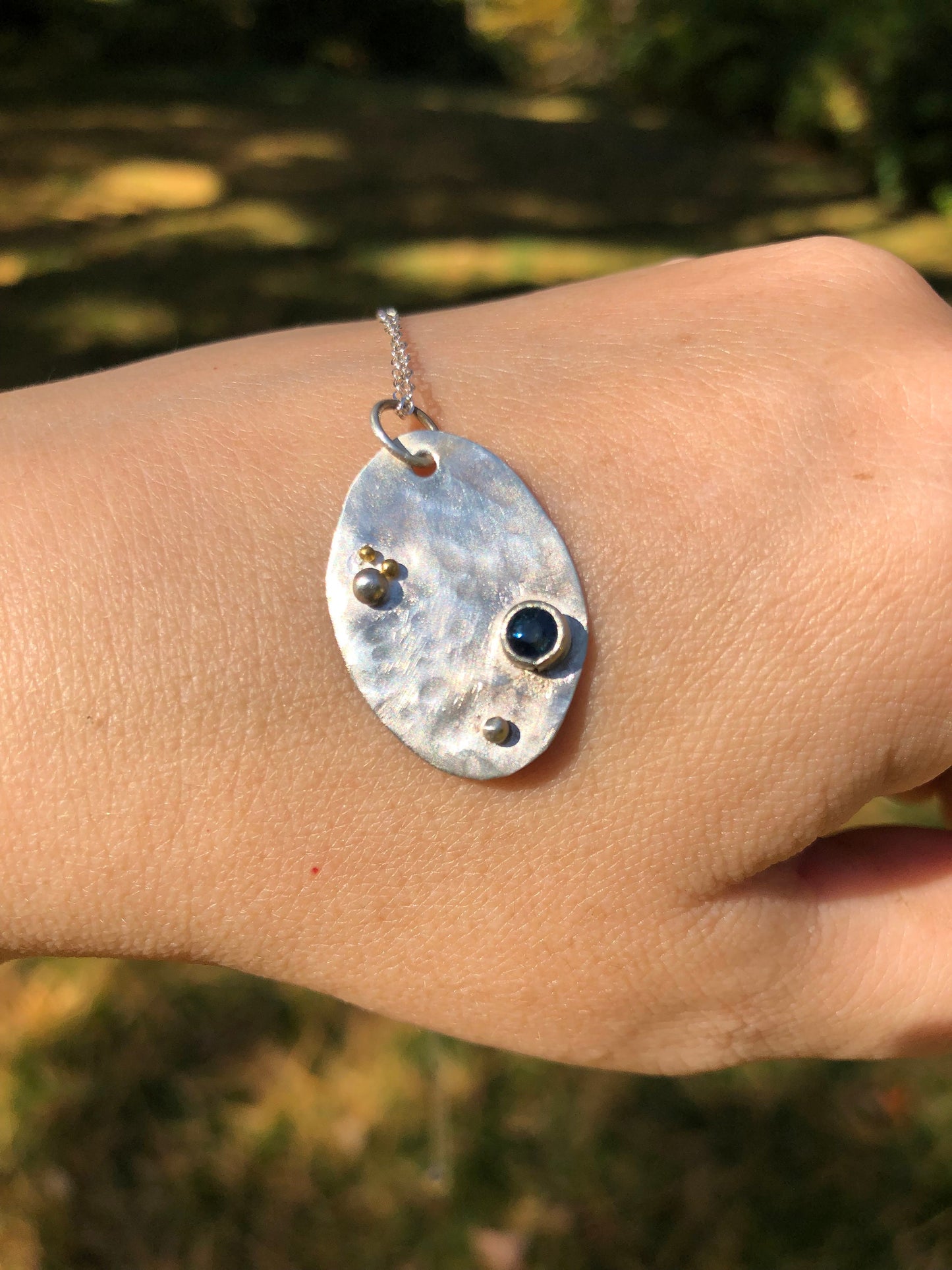Sapphire tag pendant in argentium sterling silver and 24K gold