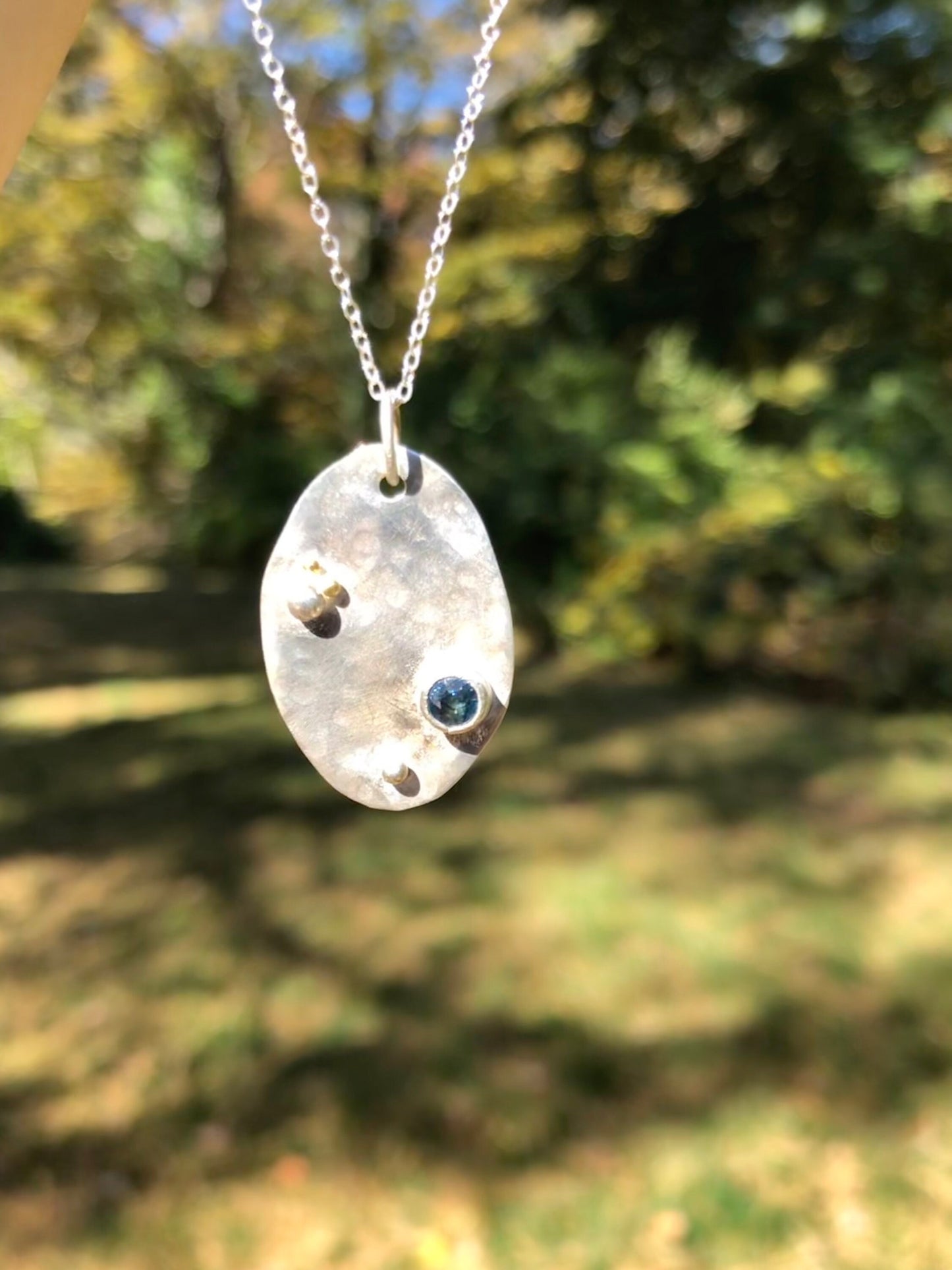 Sapphire tag pendant in argentium sterling silver and 24K gold