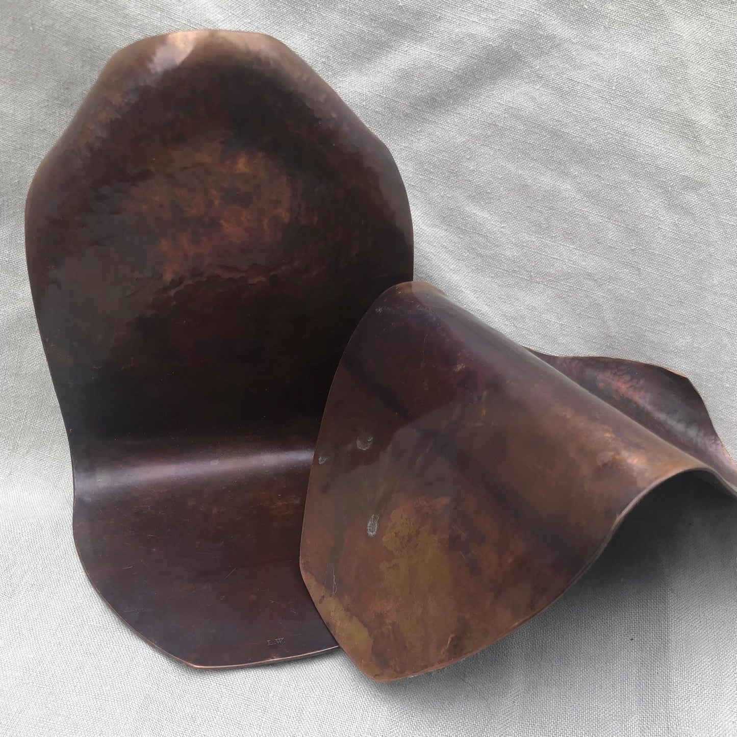 Hammered copper bookends with warm copper patina