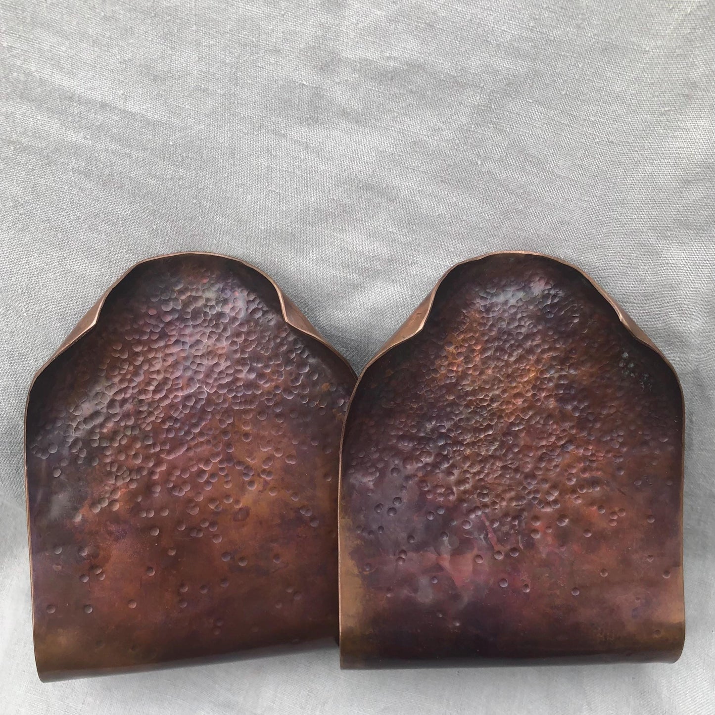Hammered copper bookends with warm copper patina