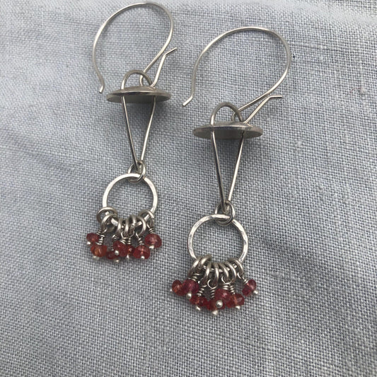 Red-orange sapphire kinetic chandelier earrings in argentium sterling silver