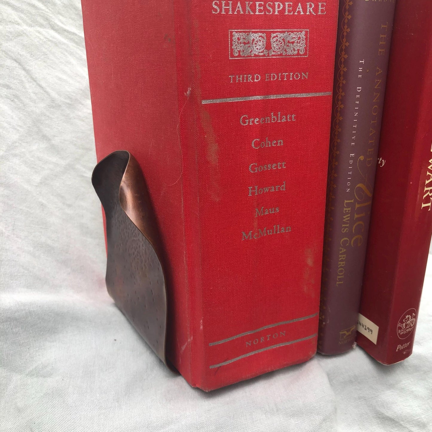 Hammered copper bookends with warm copper patina