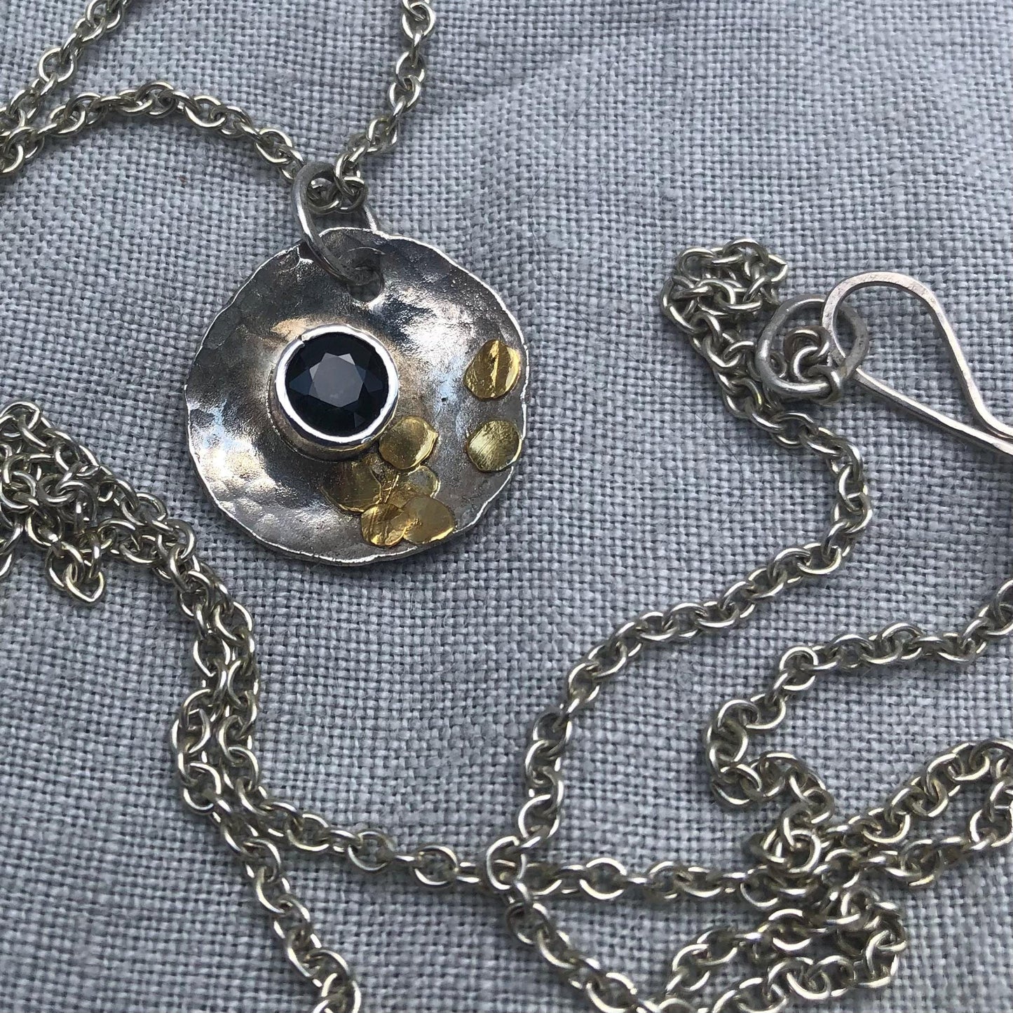 Natural earth-mined sapphire pendant in argentium silver and 24 karat gold