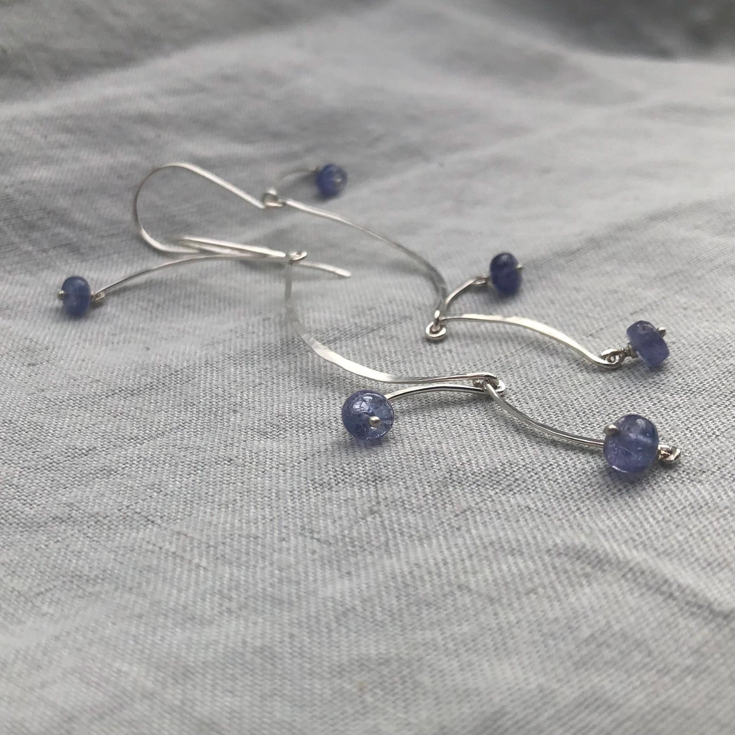 Kinetic sculptural tanzanite earrings in argentium sterling silver // Long Calder Earrings