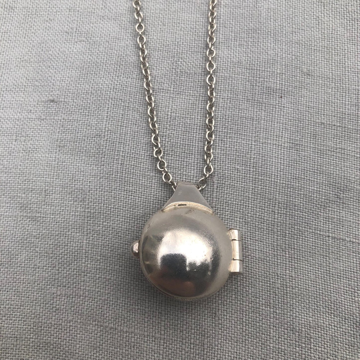 Garnet locket in argentium sterling silver // Porthole locket