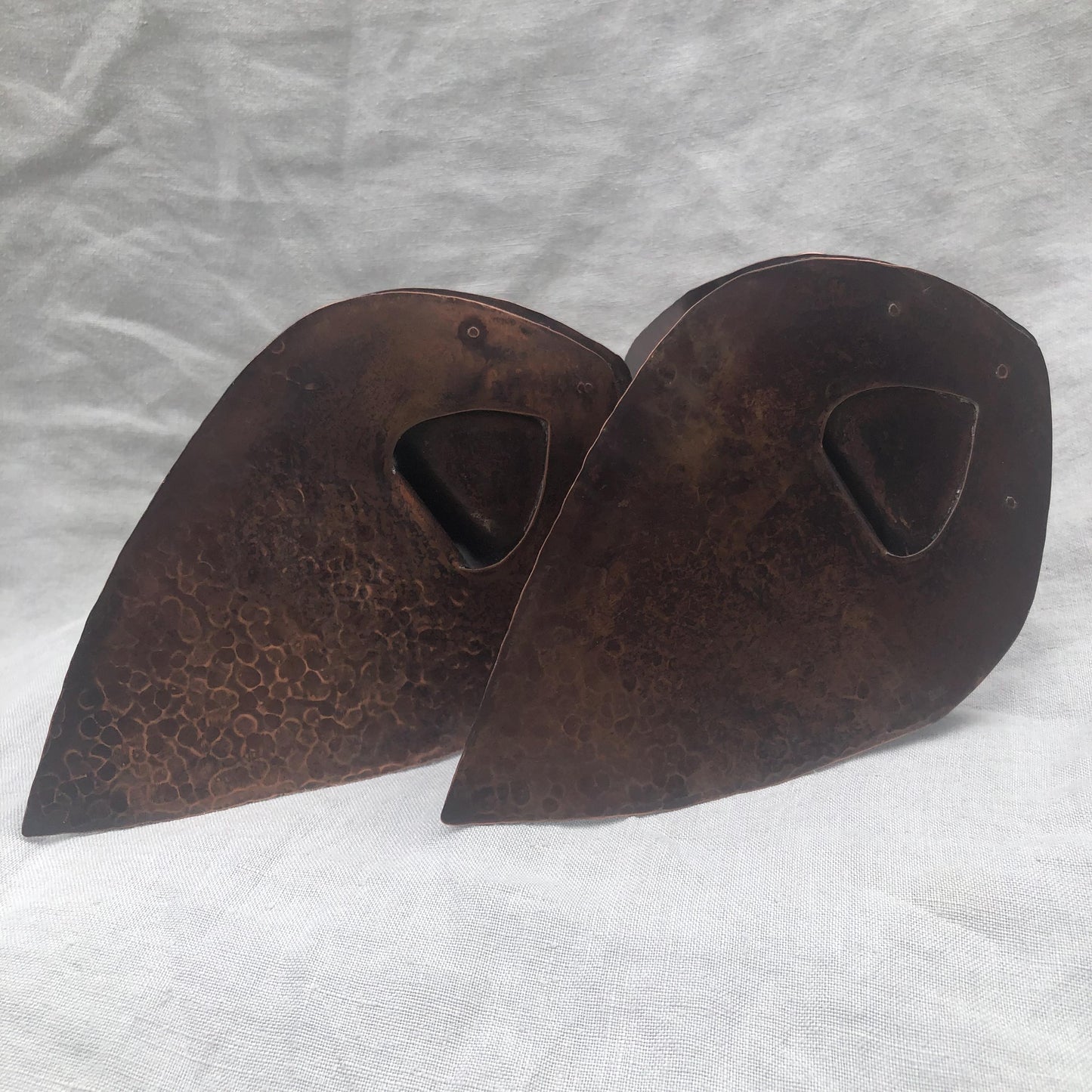 Riveted hammered copper bookends with warm copper patina
