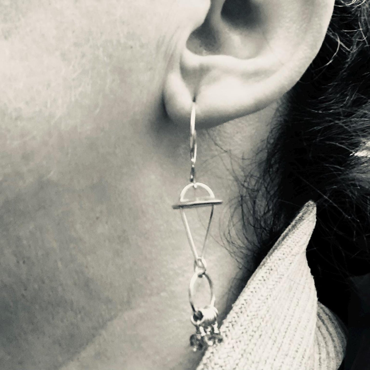 Red-orange sapphire kinetic chandelier earrings in argentium sterling silver