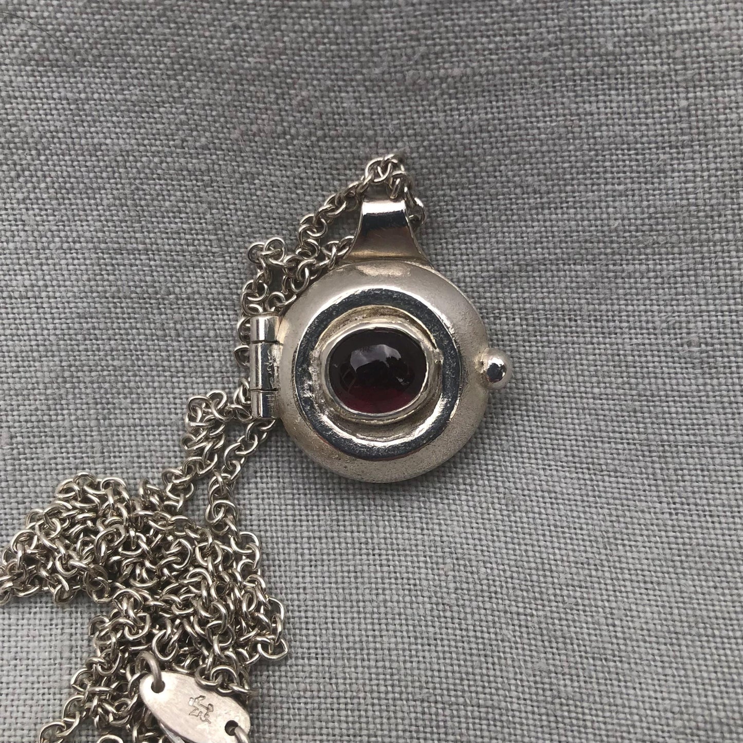 Garnet locket in argentium sterling silver // Porthole locket