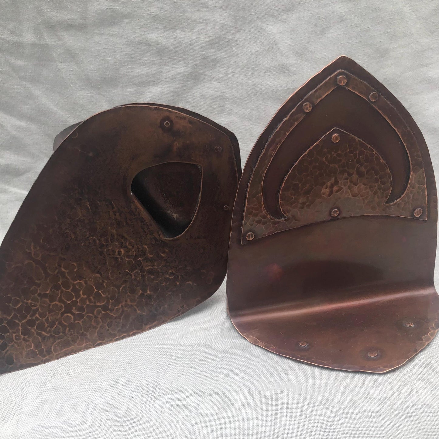 Riveted hammered copper bookends with warm copper patina