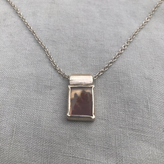 Dendritic agate pendant in argentium sterling silver // Red picture agate with open back