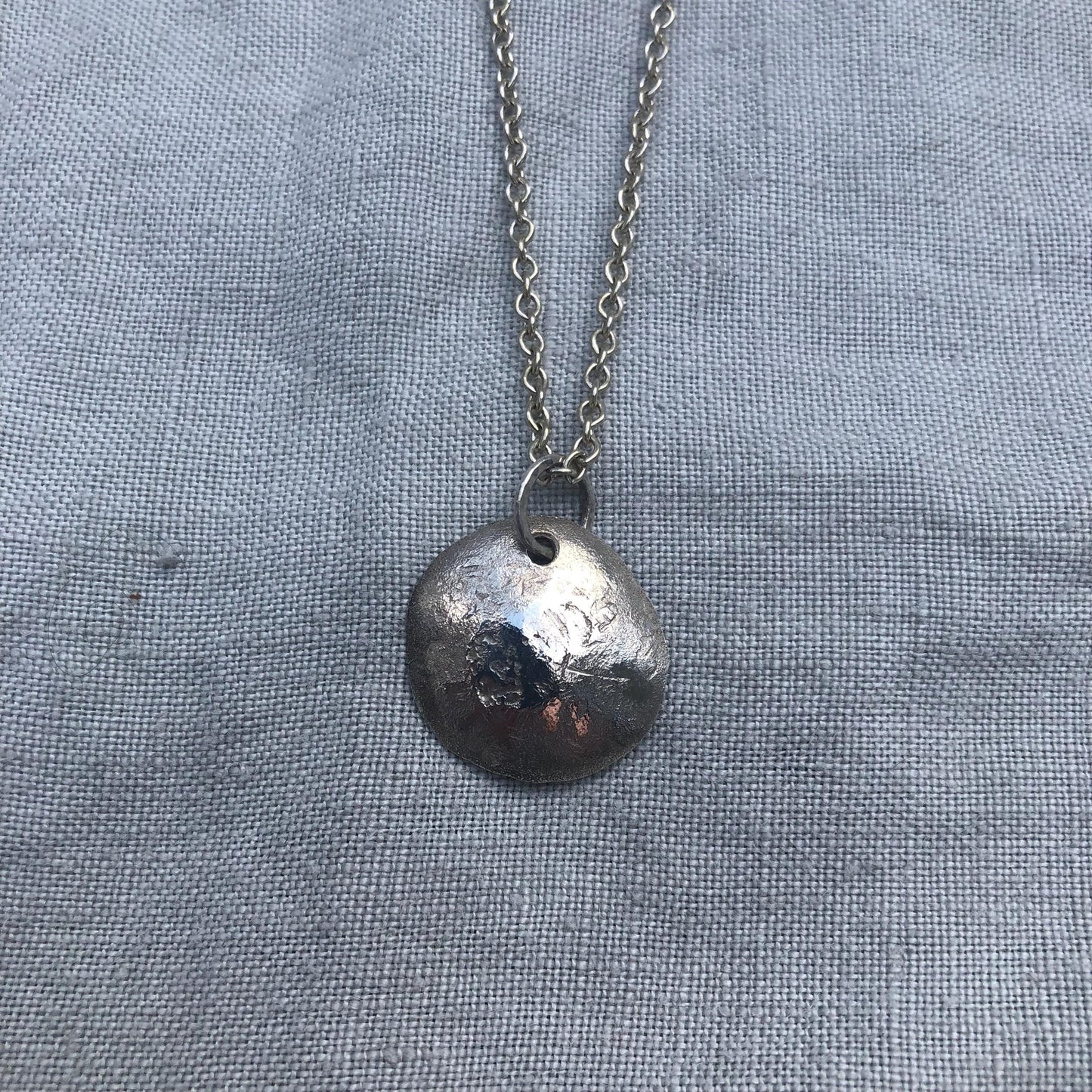 Natural earth-mined sapphire pendant in argentium silver and 24 karat gold