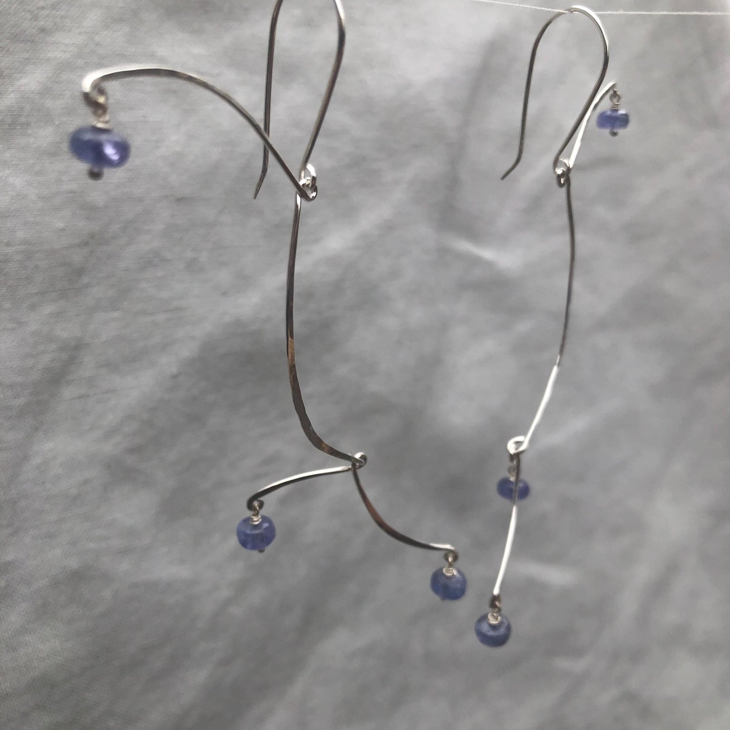 Kinetic sculptural tanzanite earrings in argentium sterling silver // Long Calder Earrings