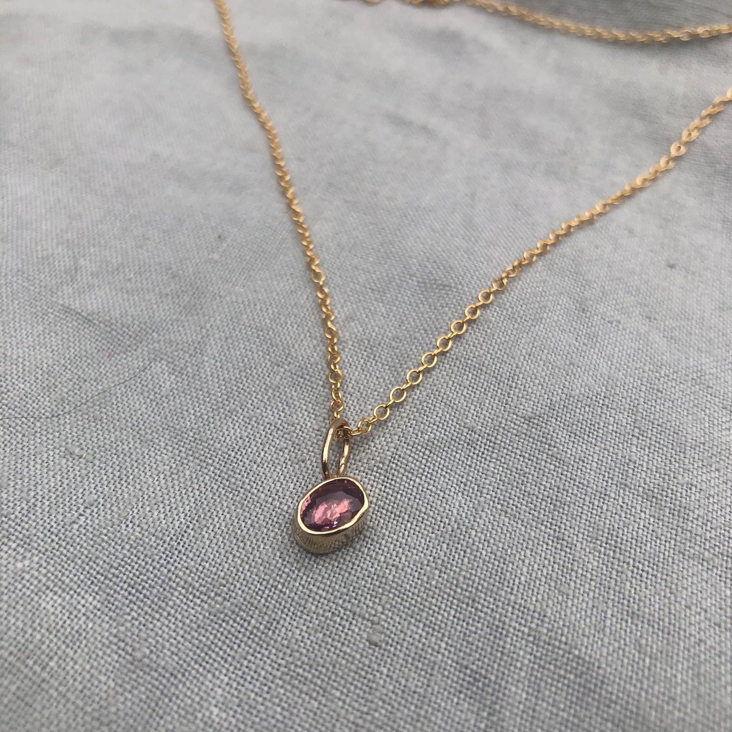 Solid gold padparadscha sapphire charm pendant // Asymmetrical unheated pink sapphire 14 karat gold necklace