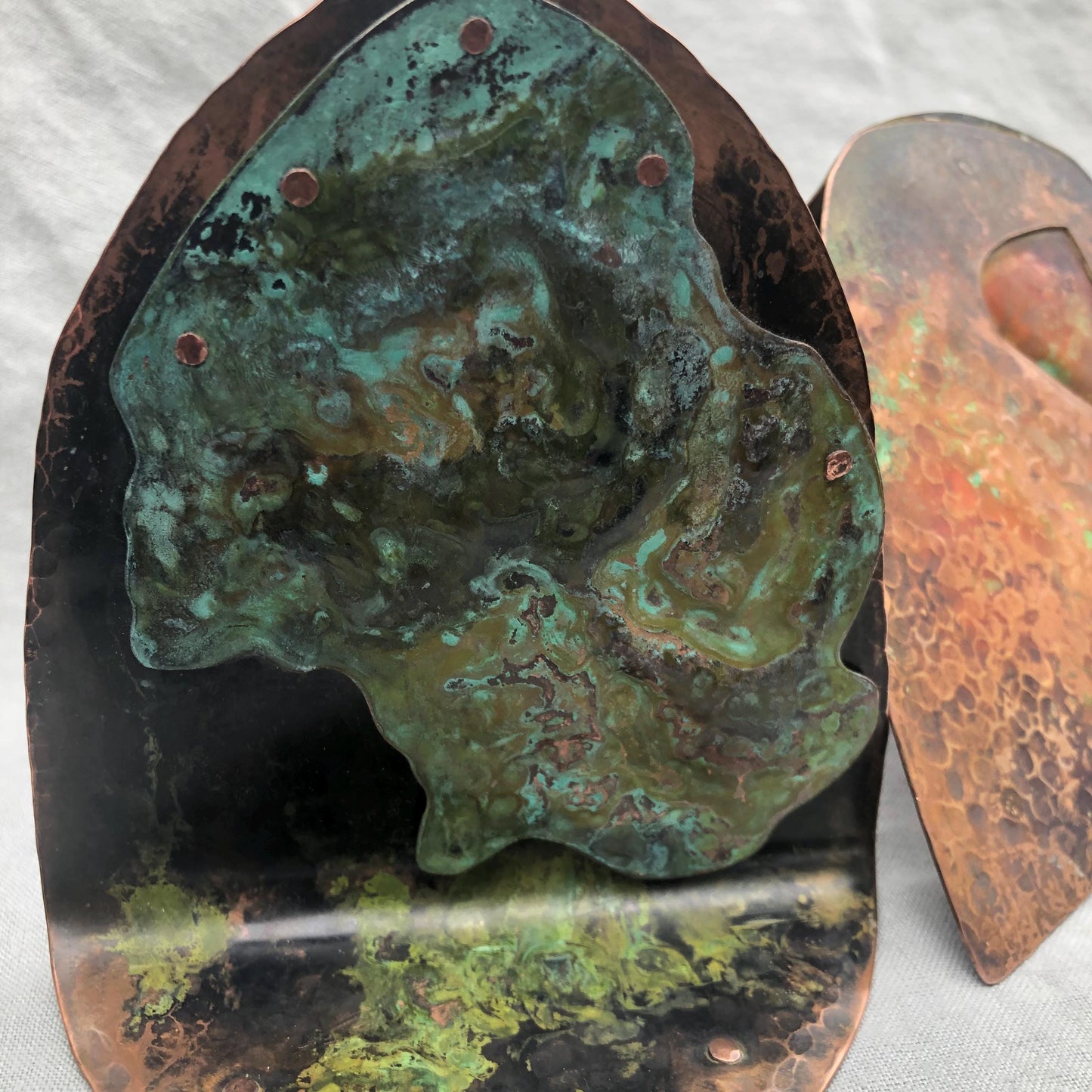 Riveted copper bookends with verdigris patina
