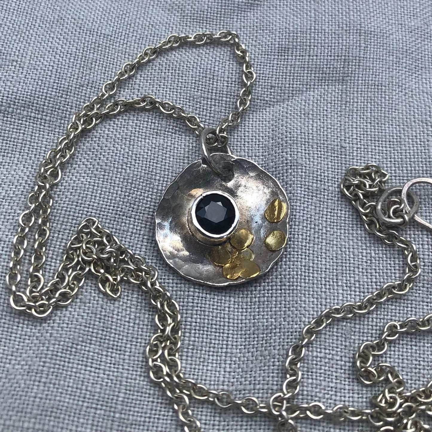 Natural earth-mined sapphire pendant in argentium silver and 24 karat gold