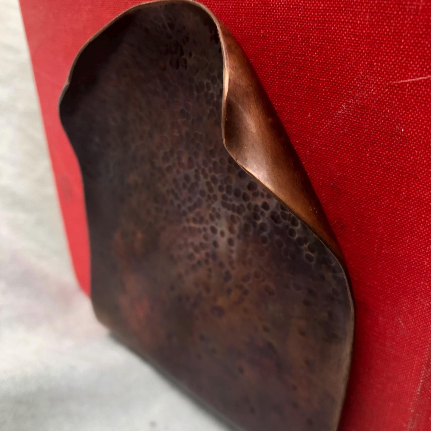 Hammered copper bookends with warm copper patina