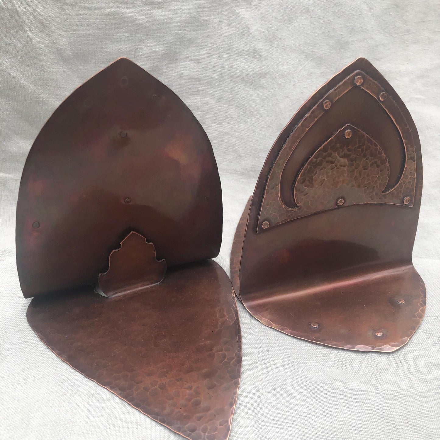 Riveted hammered copper bookends with warm copper patina