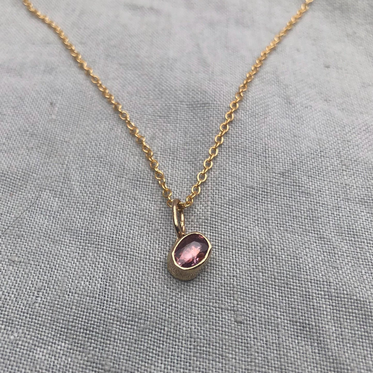 Solid gold padparadscha sapphire charm pendant // Asymmetrical unheated pink sapphire 14 karat gold necklace