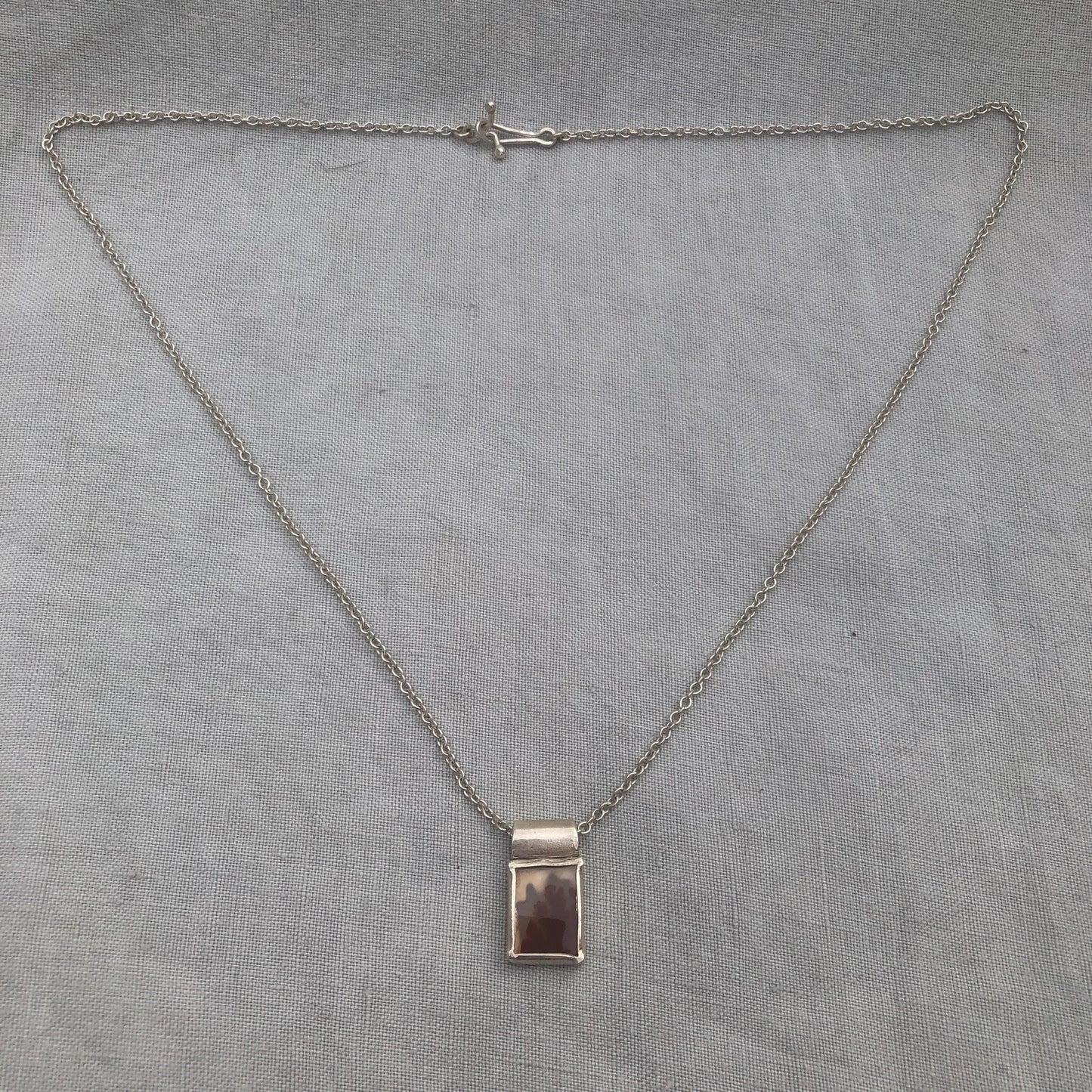 Dendritic agate pendant in argentium sterling silver // Red picture agate with open back