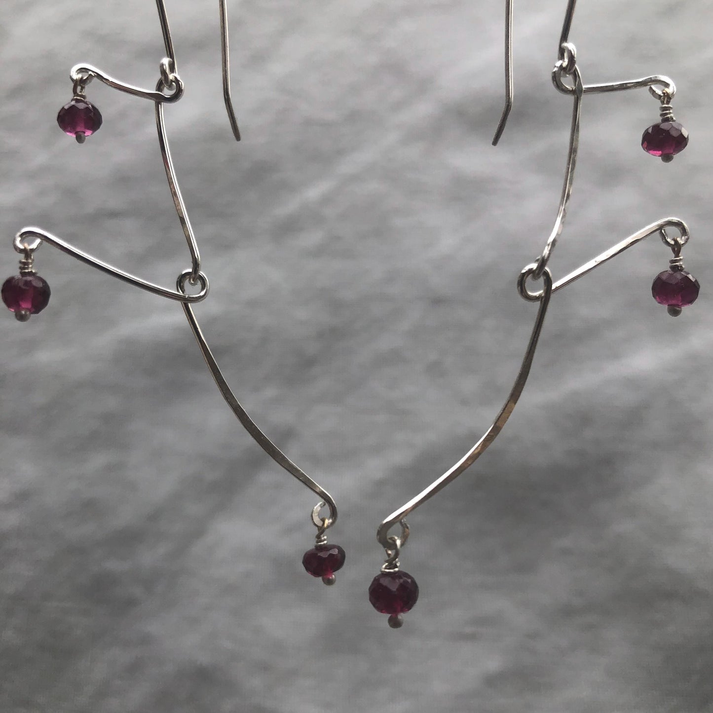 Kinetic sculptural garnet earrings in argentium sterling silver // Rhodolite garnet Calder earrings