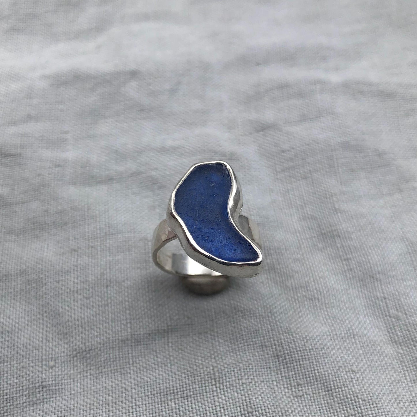 Freeform blue sea glass ring in argentium sterling silver // Bean-shaped found beach glass ring // U.S. size 5