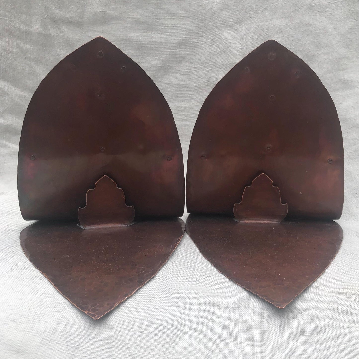 Riveted hammered copper bookends with warm copper patina