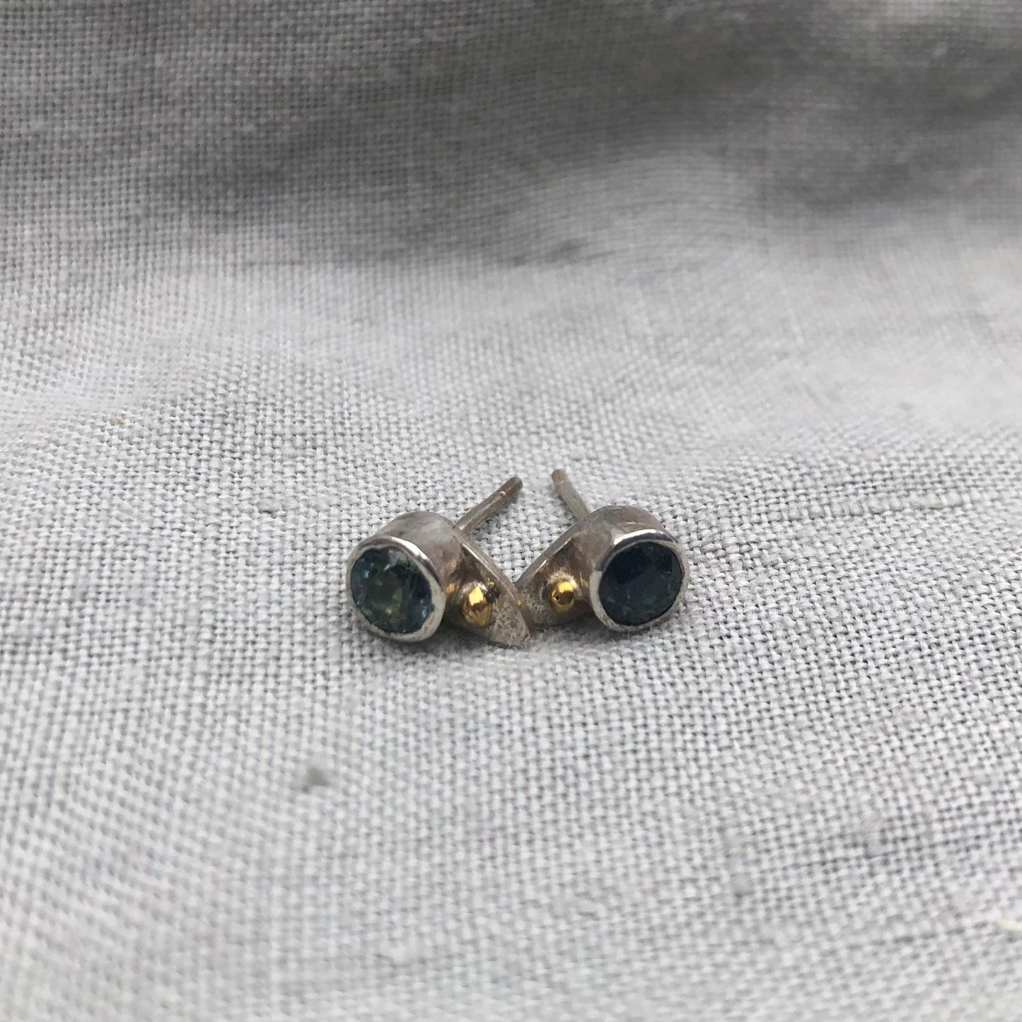 Natural earth-mined sapphire stud earrings in argentium sterling silver and 24 karat gold