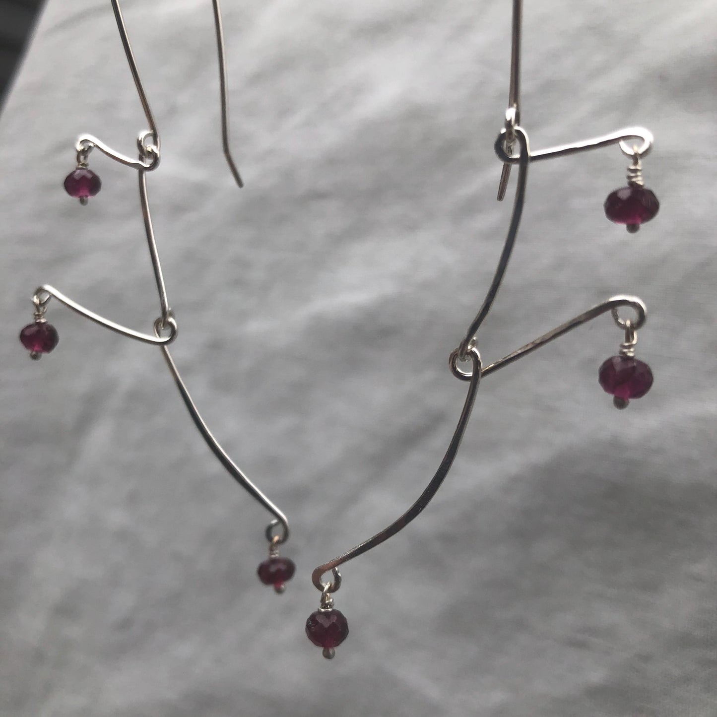 Kinetic sculptural garnet earrings in argentium sterling silver // Rhodolite garnet Calder earrings