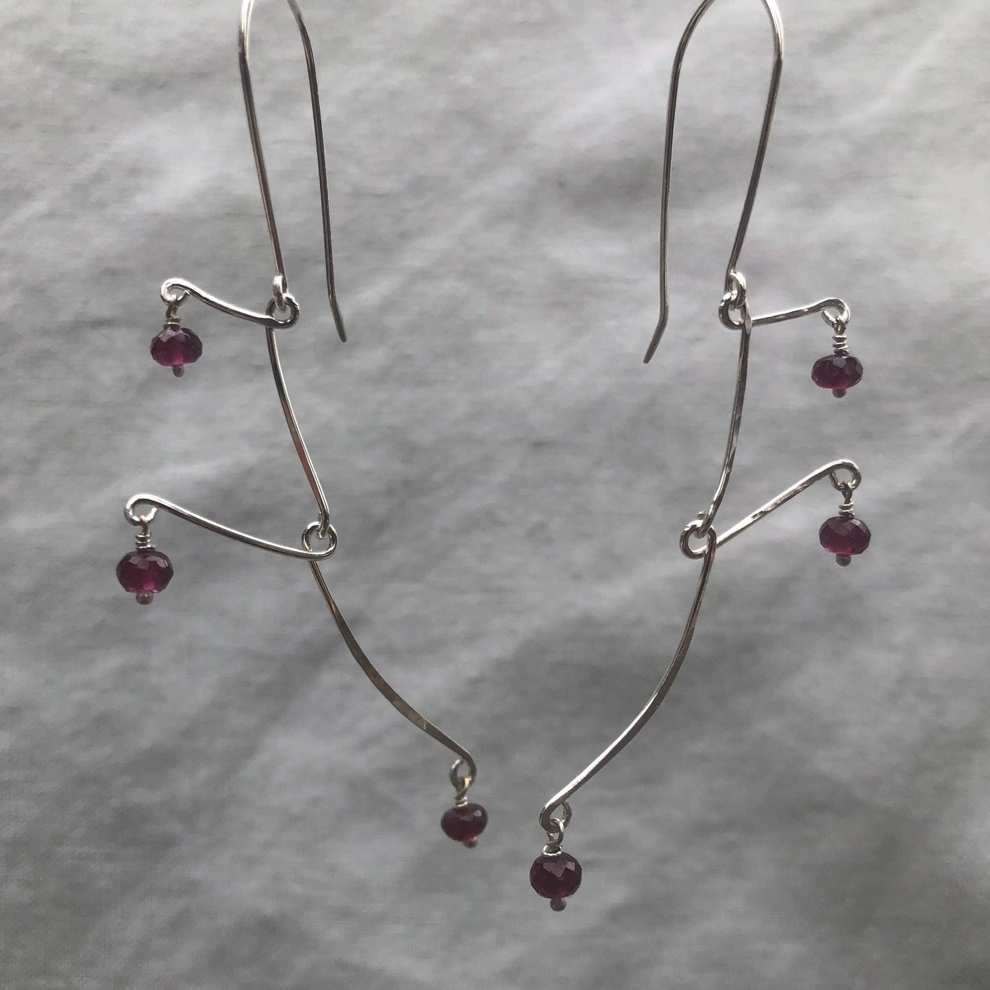 Kinetic sculptural garnet earrings in argentium sterling silver // Rhodolite garnet Calder earrings