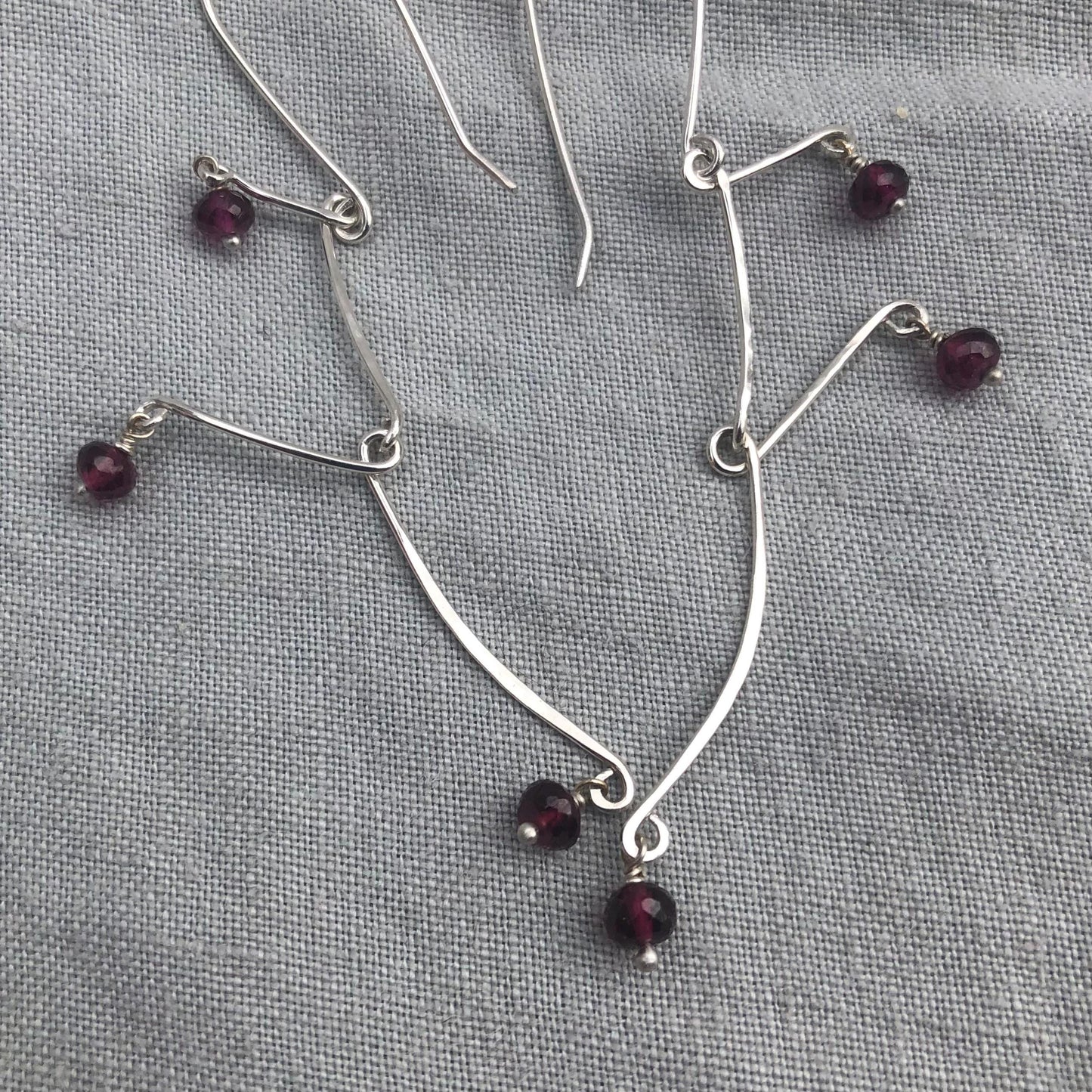 Kinetic sculptural garnet earrings in argentium sterling silver // Rhodolite garnet Calder earrings