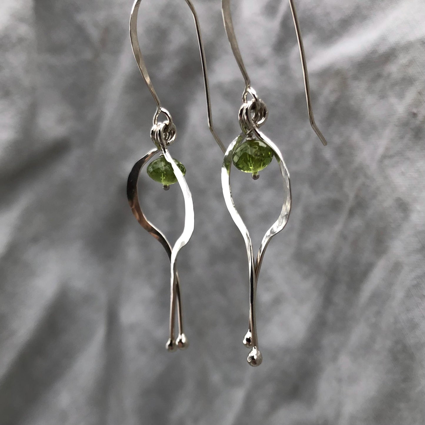 Double scoop earrings in argentium sterling silver with microfaceted peridot // Kinetic sculptural earrings // August birthstone earrings