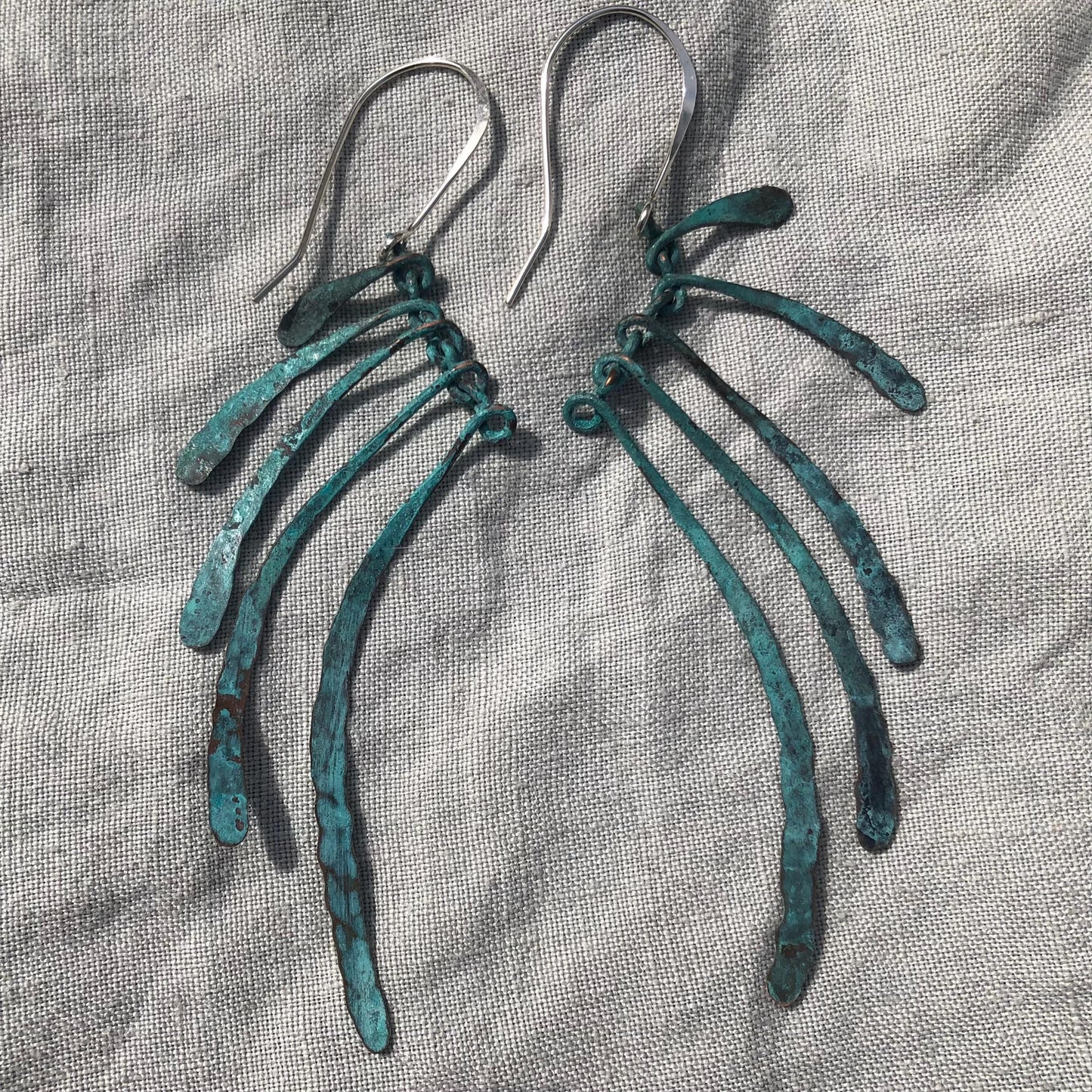 Bare bones earrings in copper with blue-green verdigris patina