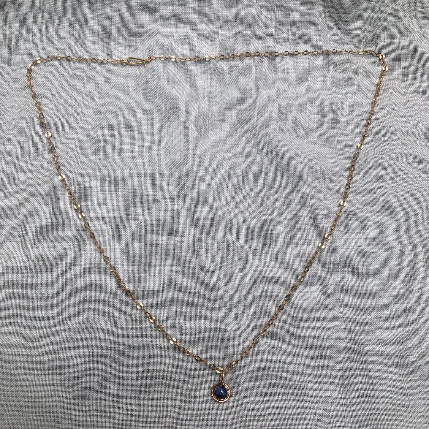 Natural blue sapphire cabochon pendant in solid 14 karat gold