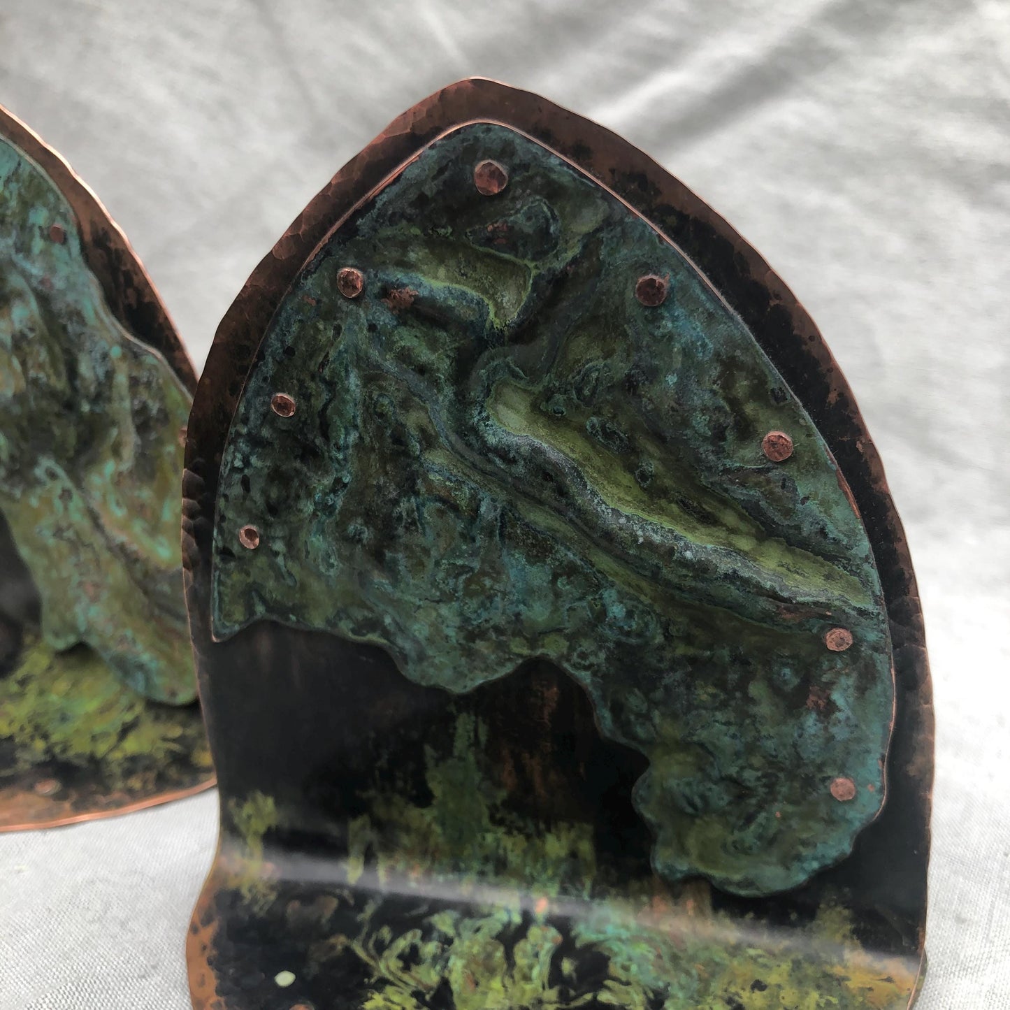 Riveted copper bookends with verdigris patina