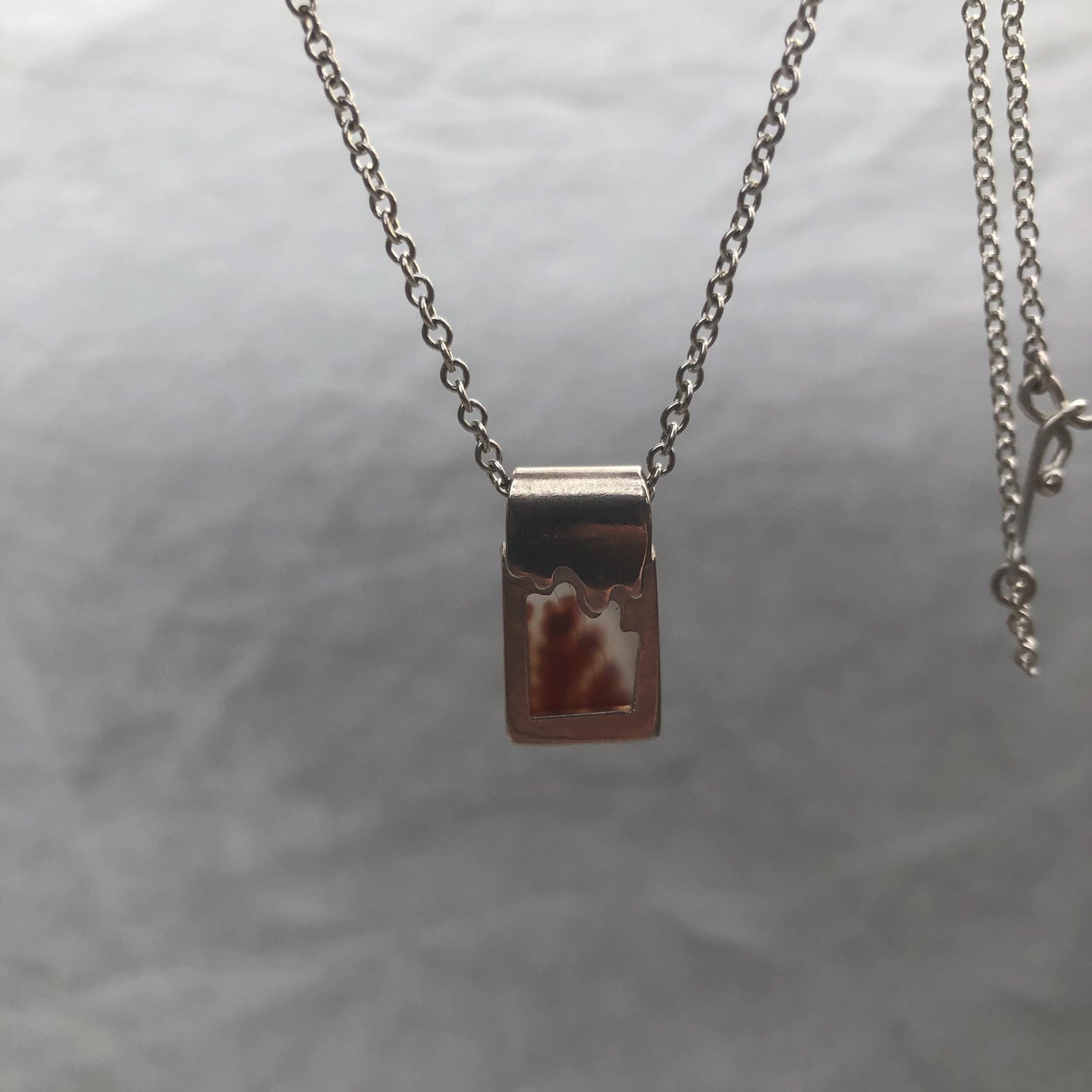 Dendritic agate pendant in argentium sterling silver // Red picture agate with open back