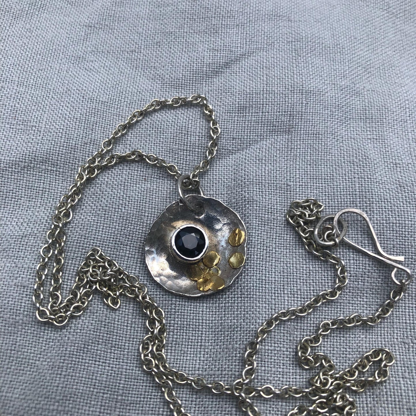 Natural earth-mined sapphire pendant in argentium silver and 24 karat gold