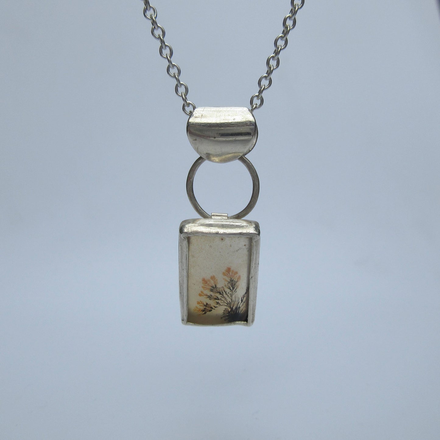 Disappearing dendritic agate pendant in argentium sterling silver