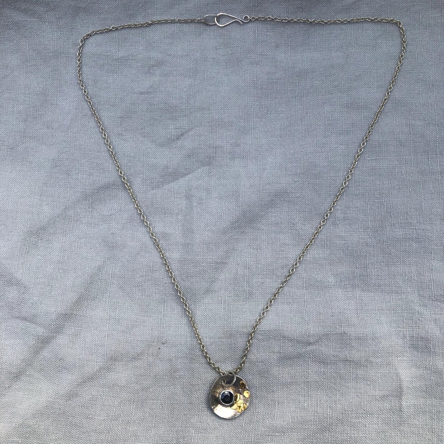 Natural earth-mined sapphire pendant in argentium silver and 24 karat gold