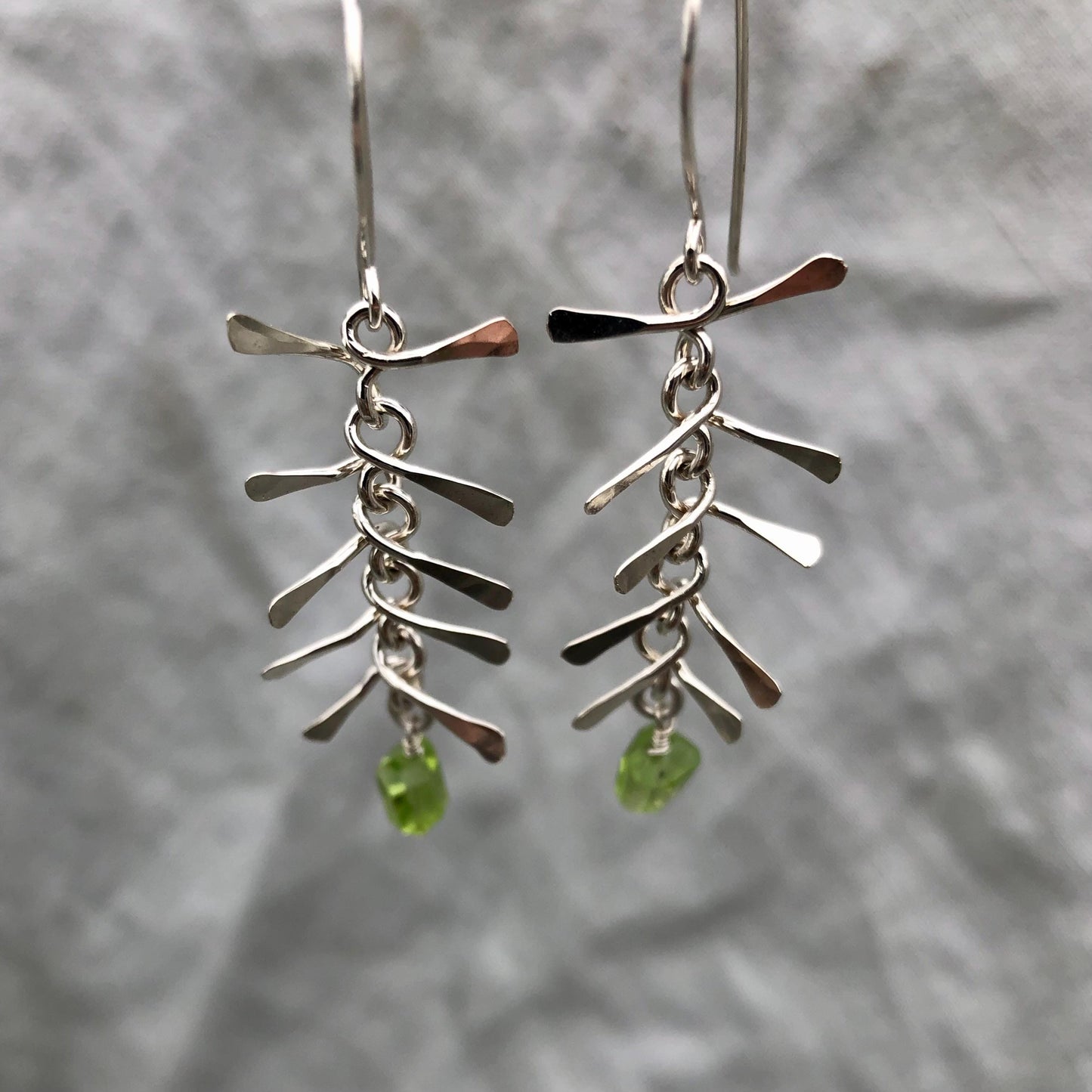 Ribcage earrings in argentium sterling silver with asymmetrical Arizona peridot // Kinetic sculptural earrings