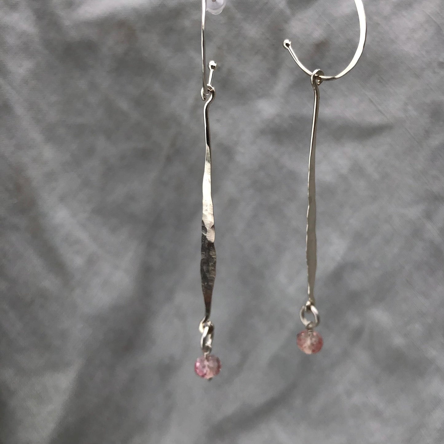 Hammered drop earrings in argentium sterling silver with microfaceted pink sapphires // Kinetic sculptural September birthstone earrings