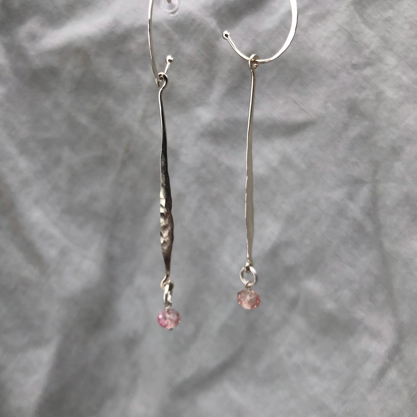 Hammered drop earrings in argentium sterling silver with microfaceted pink sapphires // Kinetic sculptural September birthstone earrings